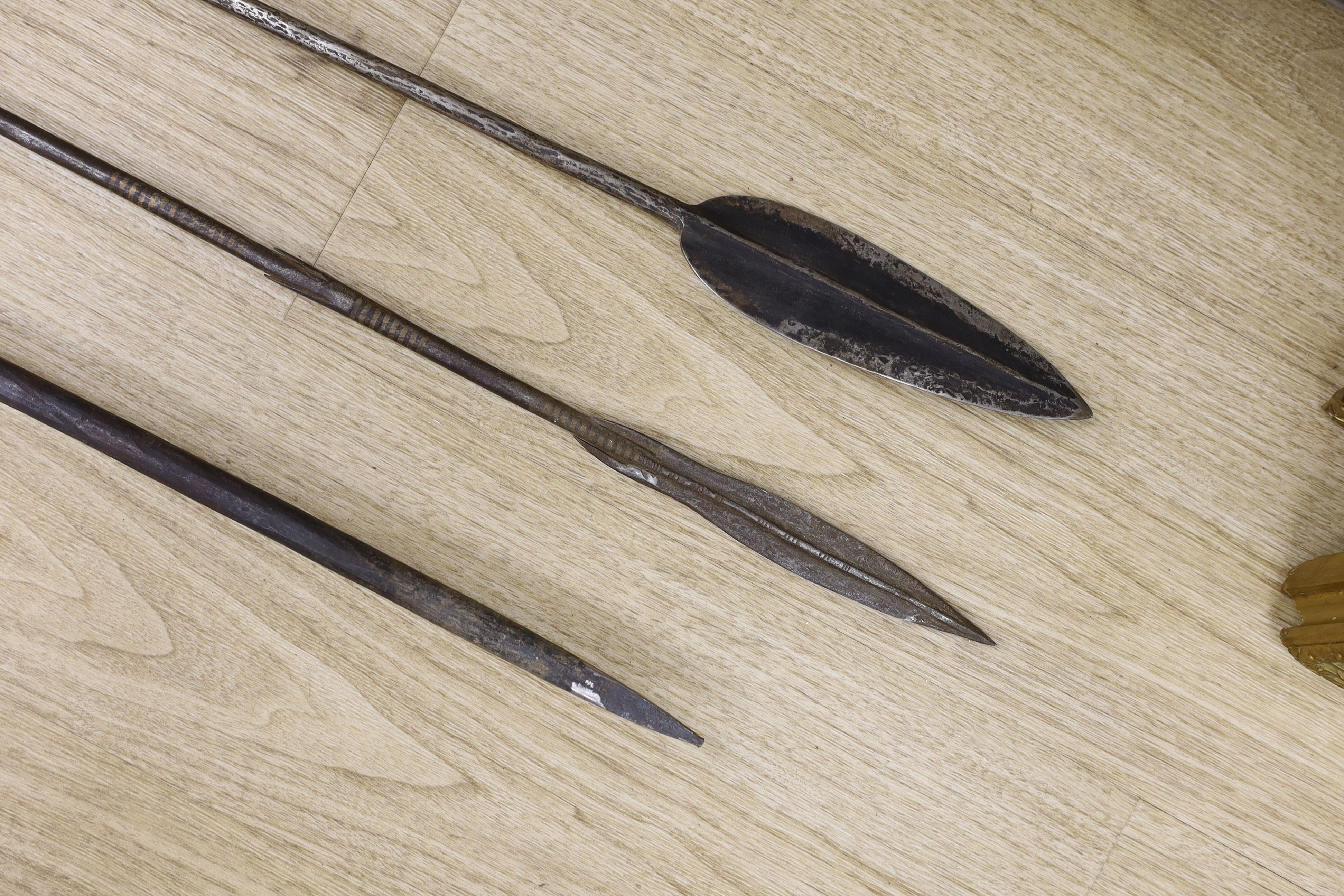 A group of three tribal spears, possibly Ashante, longest 203 cms.